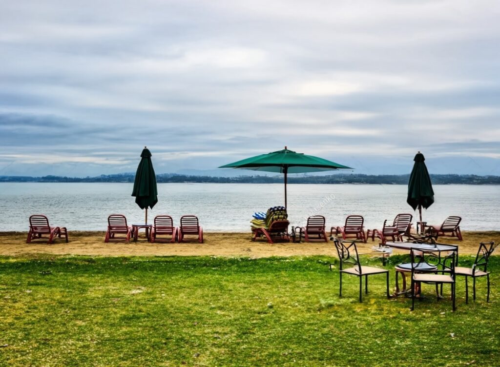 stock-photo-tropical-beach-panorama-with-deck-chairs-umbrellas-table-lake-kivu-gisenyi-rwanda-1151749367~2